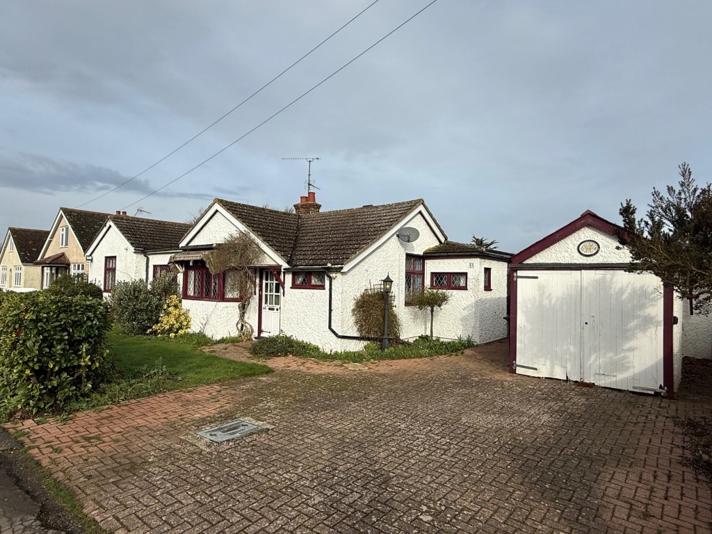 Lot: 155 - DETACHED BUNGALOW FOR IMPROVEMENT IN POPULAR LOCATION - Front of the detached bungalow with garage and parking
